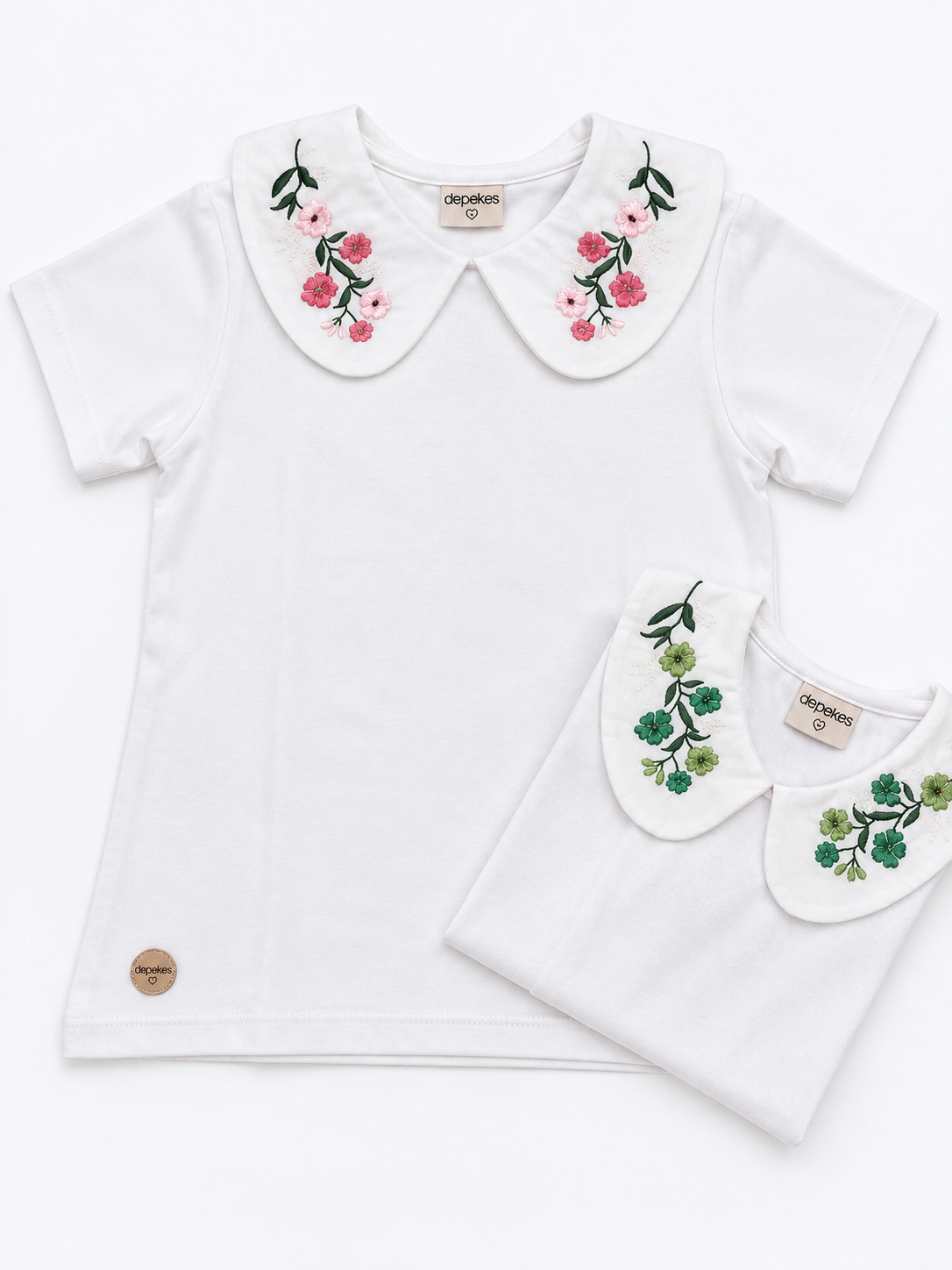 Remera Infantil Blanca con Cuello Bordado Floral – Rosa o Verde